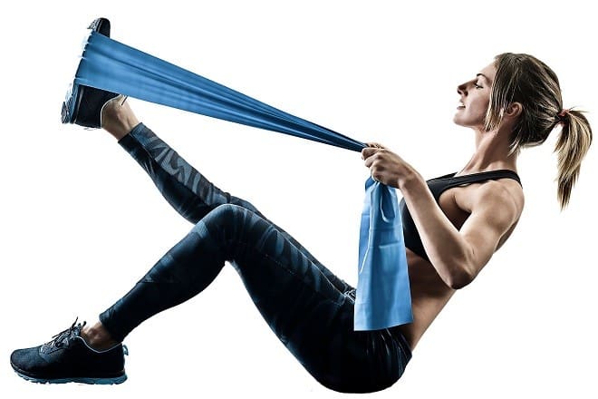 one caucasian woman exercising pilates fitness elastic resistant